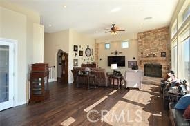 Dining room, Fireplace, Interior, Living room, Recessed Lighting, Stone Walls, Wood Texture Flooring