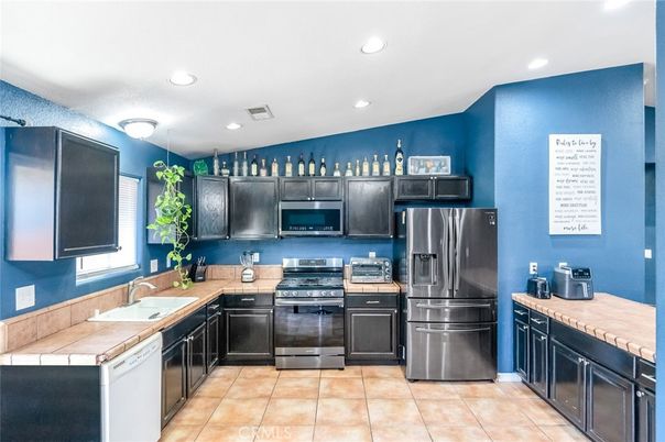 Interior, Kitchen, Recessed Lighting, Stainless Steel Appliances, Tile Countertops