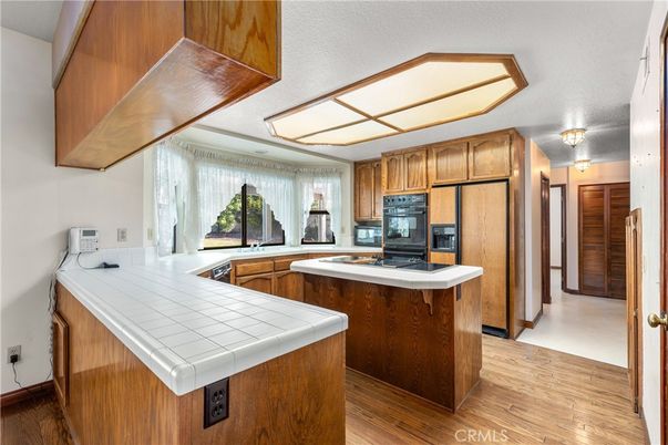 Interior, Kitchen, Tile Countertops, Wood Texture Flooring