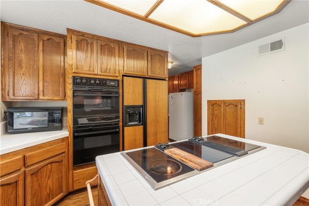 Interior, Kitchen, Tile Countertops, Wood Texture Flooring