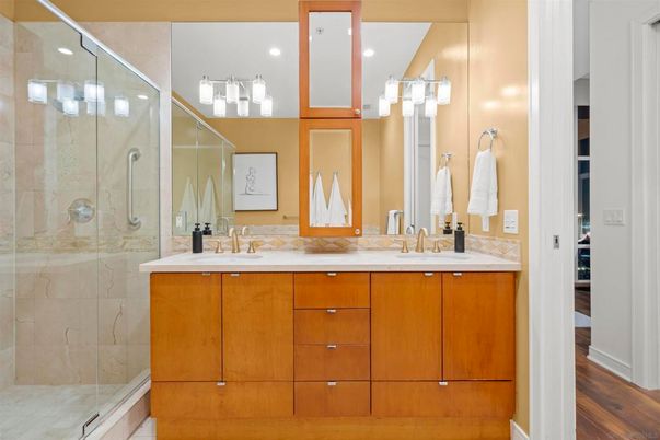 Bathroom, Dual Sink Vanities, Glass Shower, Interior, Recessed Lighting, Wood Texture Flooring