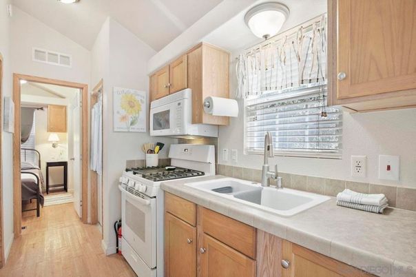 Interior, Kitchen, Tile Countertops, Wood Texture Flooring