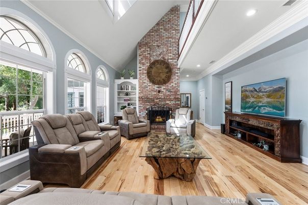 Fireplace, Interior, Living room, Recessed Lighting, Stone Walls, Wood Texture Flooring