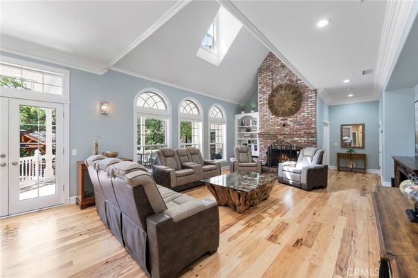 Fireplace, Interior, Living room, Recessed Lighting, Stone Walls, Wood Texture Flooring