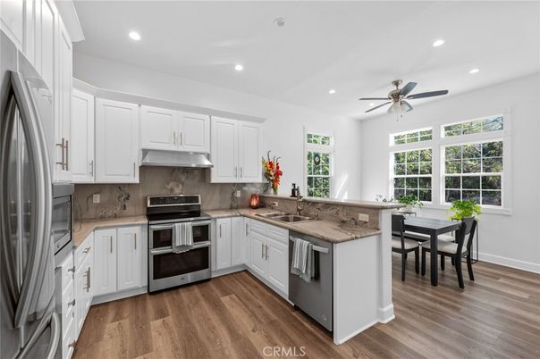 Dining room, Interior, Kitchen, Recessed Lighting, Stainless Steel Appliances, Wood Texture Flooring