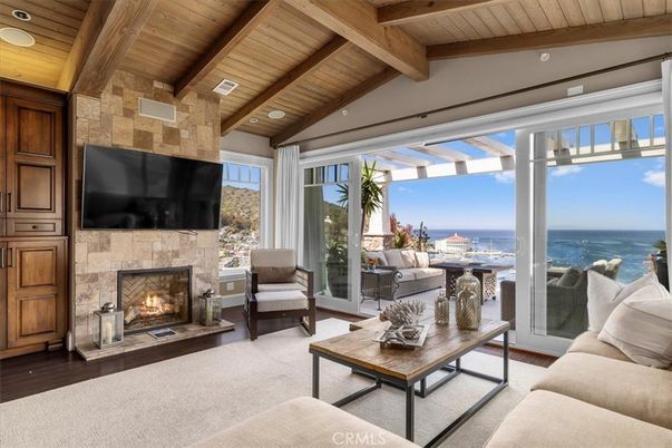 Fireplace, Interior, Living room, Recessed Lighting, Stone Walls, Water, Wooden Beams, Wooden Ceilings