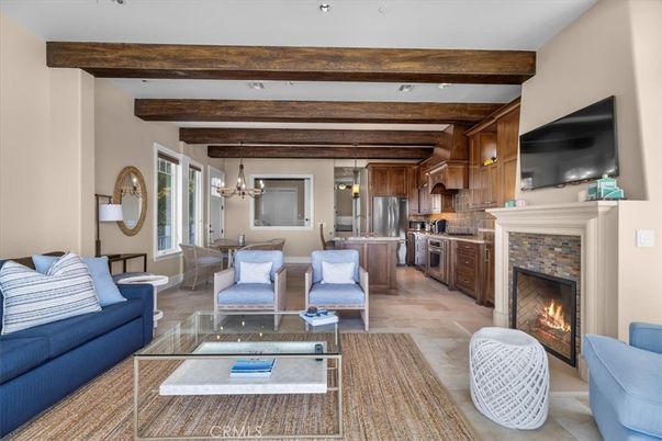 Chandelier, Dining room, Fireplace, Interior, Kitchen, Living room, Pendant Lights, Recessed Lighting, Stainless Steel Appliances, Wooden Beams