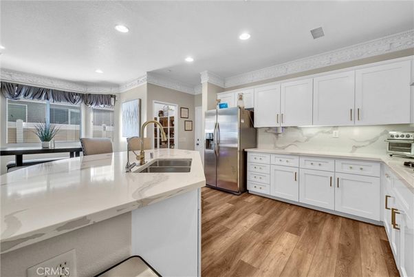 Interior, Kitchen, Marble Walls, Recessed Lighting, Stainless Steel Appliances, Wood Texture Flooring