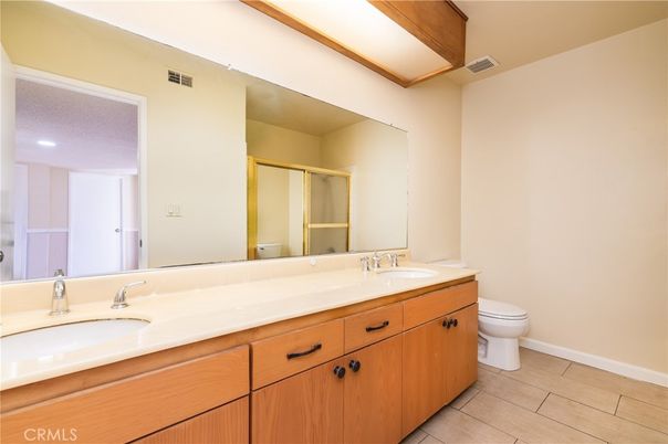Bathroom, Dual Sink Vanities, Interior, Recessed Lighting, Wood Texture Flooring