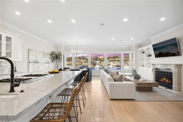 Chandelier, Dining room, Fireplace, Interior, Kitchen, Living room, Recessed Lighting, Wood Texture Flooring