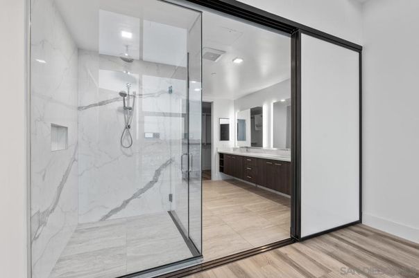 Bathroom, Glass Shower, Interior, Marble Walls, Recessed Lighting, Wood Texture Flooring