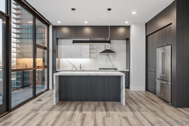 Interior, Kitchen, Marble Walls, Pendant Lights, Recessed Lighting, Stainless Steel Appliances, Wood Texture Flooring