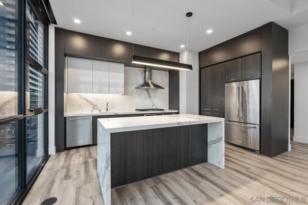 Interior, Kitchen, Marble Walls, Pendant Lights, Recessed Lighting, Stainless Steel Appliances, Wood Texture Flooring