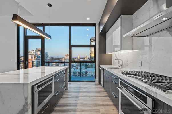 Interior, Kitchen, Marble Walls, Pendant Lights, Recessed Lighting, Stainless Steel Appliances, Wood Texture Flooring