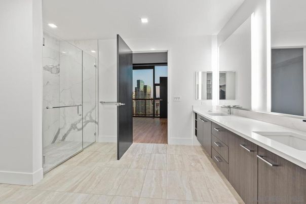 Bathroom, Dual Sink Vanities, Glass Shower, Interior, Marble, Marble Walls, Recessed Lighting, Wood Texture Flooring
