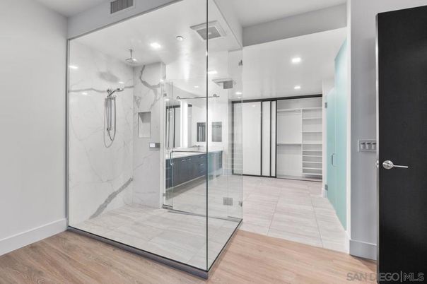 Bathroom, Glass Shower, Interior, Marble Walls, Recessed Lighting, Wood Texture Flooring