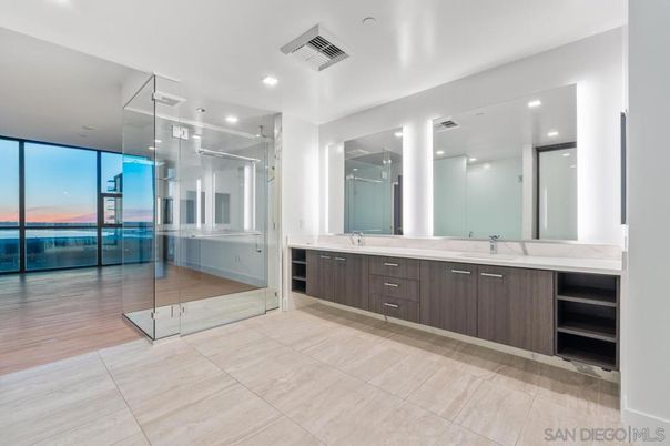 Bathroom, Dual Sink Vanities, Glass Shower, Interior, Recessed Lighting, Water, Wood Texture Flooring