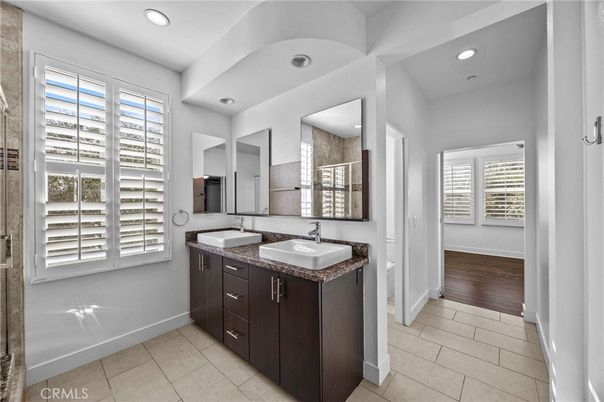 Bathroom, Dual Sink Vanities, Interior, Recessed Lighting, Wood Texture Flooring