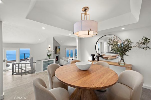 Dining room, Fireplace, Interior, Living room, Pendant Lights, Recessed Lighting, Water, Wood Texture Flooring