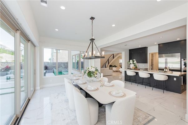 Chandelier, Dining room, Interior, Kitchen, Marble, Pendant Lights, Recessed Lighting, Stainless Steel Appliances