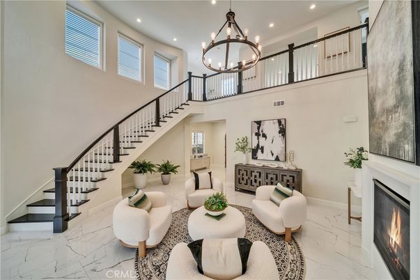 Chandelier, Fireplace, Interior, Living room, Marble, Recessed Lighting
