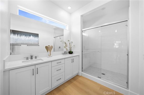 Bathroom, Dual Sink Vanities, Glass Shower, Interior, Recessed Lighting, Wood Texture Flooring