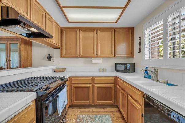 Interior, Kitchen, Tile Countertops, Wood Texture Flooring