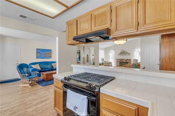 Fireplace, Interior, Kitchen, Living room, Tile Countertops, Wood Texture Flooring