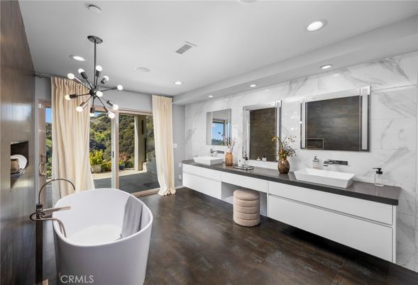 Bathroom, Dual Sink Vanities, Free Standing Baths, Interior, Marble Walls, Pendant Lights, Recessed Lighting, Wood Texture Flooring
