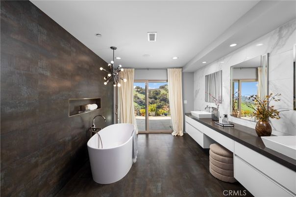 Bathroom, Dual Sink Vanities, Free Standing Baths, Interior, Marble Walls, Pendant Lights, Recessed Lighting, Wood Texture Flooring