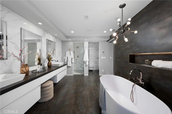 Bathroom, Dual Sink Vanities, Free Standing Baths, Glass Shower, Interior, Marble Walls, Pendant Lights, Recessed Lighting, Wood Texture Flooring
