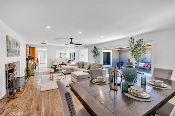 Dining room, Fireplace, Interior, Living room, Recessed Lighting, Wood Texture Flooring