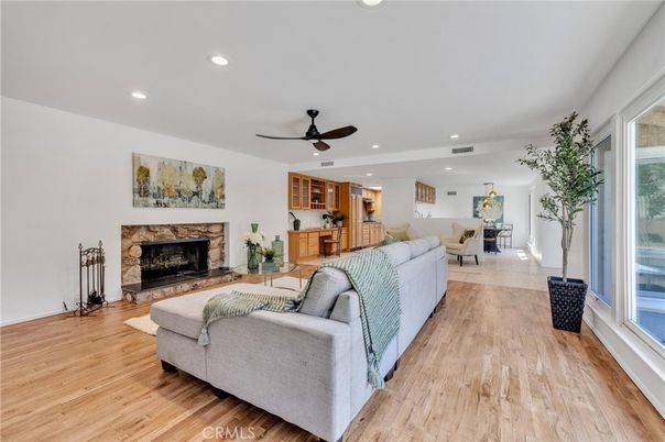 Dining room, Fireplace, Interior, Living room, Recessed Lighting, Wood Texture Flooring