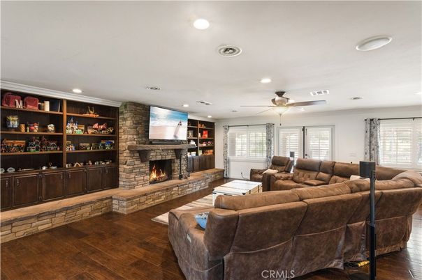 Fireplace, Interior, Living room, Recessed Lighting, Stone Walls, Wood Texture Flooring