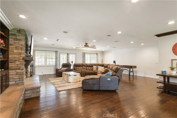 Fireplace, Interior, Living room, Recessed Lighting, Stone Walls, Wood Texture Flooring