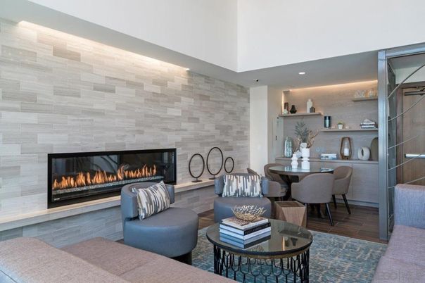 Dining room, Fireplace, Interior, Living room, Recessed Lighting, Stone Walls, Wood Texture Flooring