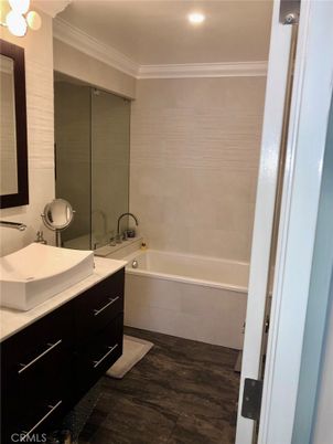 Bathroom, Dual Sink Vanities, Interior, Recessed Lighting, Wood Texture Flooring