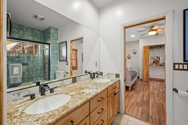Bathroom, Dual Sink Vanities, Glass Shower, Interior, Recessed Lighting, Wood Texture Flooring