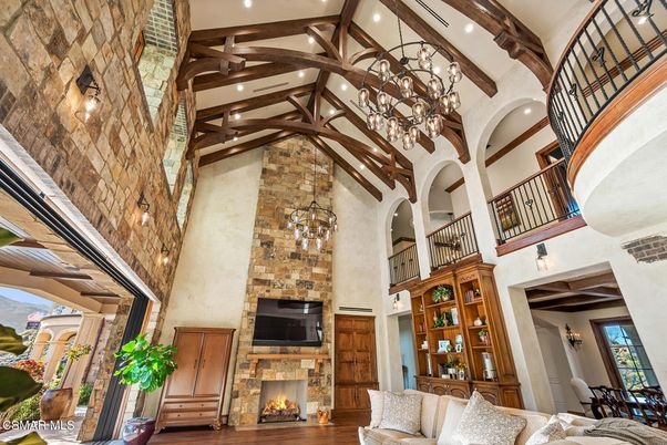 Chandelier, Fireplace, Interior, Pendant Lights, Recessed Lighting, Stone Walls, Wooden Beams, Wood Texture Flooring