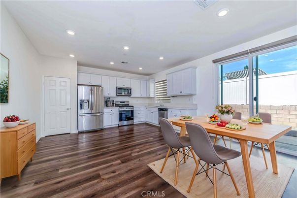 Dining room, Interior, Kitchen, Recessed Lighting, Stainless Steel Appliances, Wood Texture Flooring