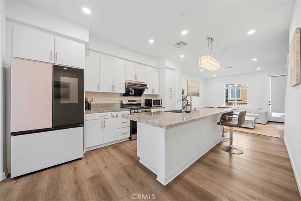 Chandelier, Interior, Kitchen, Recessed Lighting, Stainless Steel Appliances, Wood Texture Flooring