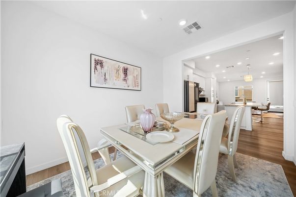 Dining room, Interior, Kitchen, Pendant Lights, Recessed Lighting, Stainless Steel Appliances, Wood Texture Flooring