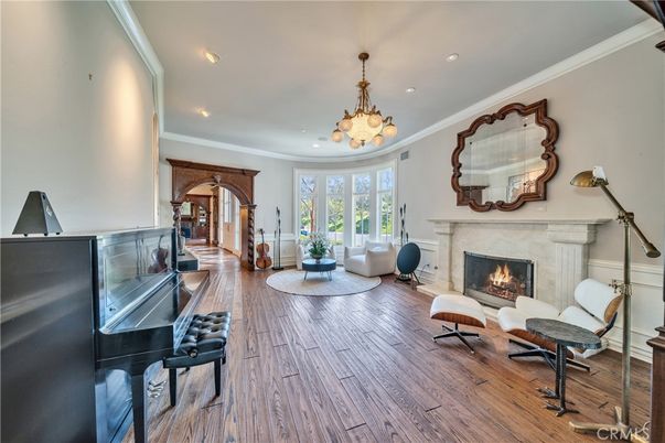 Chandelier, Fireplace, Interior, Living room, Piano, Recessed Lighting, Wood Texture Flooring