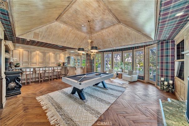 Billiard Table, Chandelier, Fireplace, Game Room, Interior, Pendant Lights, Recessed Lighting, Wooden Ceilings, Wood Texture Flooring