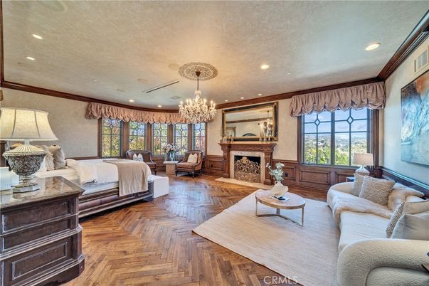 Bedroom, Chandelier, Fireplace, Interior, Living room, Recessed Lighting, Wood Texture Flooring