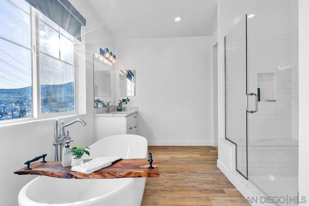 Bathroom, Free Standing Baths, Glass Shower, Interior, Recessed Lighting, Wood Texture Flooring