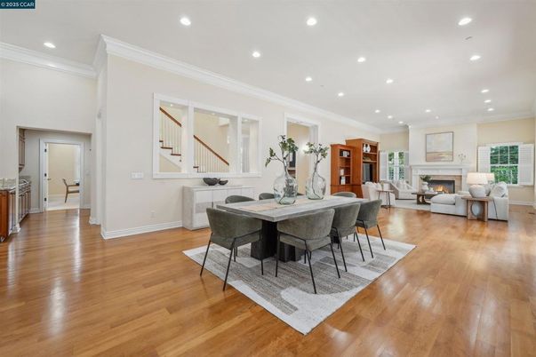 Dining room, Fireplace, Interior, Living room, Recessed Lighting, Wood Texture Flooring