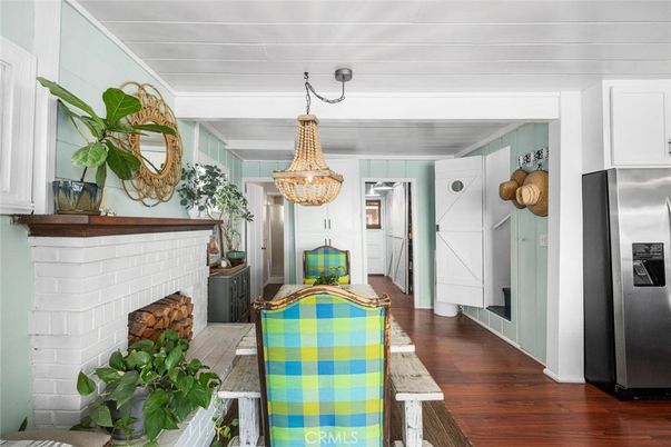 Dining room, Fireplace, Interior, Kitchen, Pendant Lights, Stainless Steel Appliances, Wood Texture Flooring