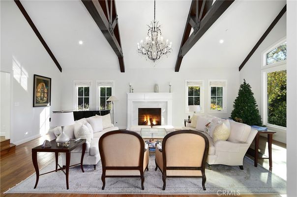 Chandelier, Fireplace, Interior, Living room, Piano, Recessed Lighting, Wooden Beams, Wood Texture Flooring