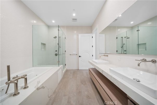 Bathroom, Dual Sink Vanities, Glass Shower, Interior, Recessed Lighting, Wood Texture Flooring